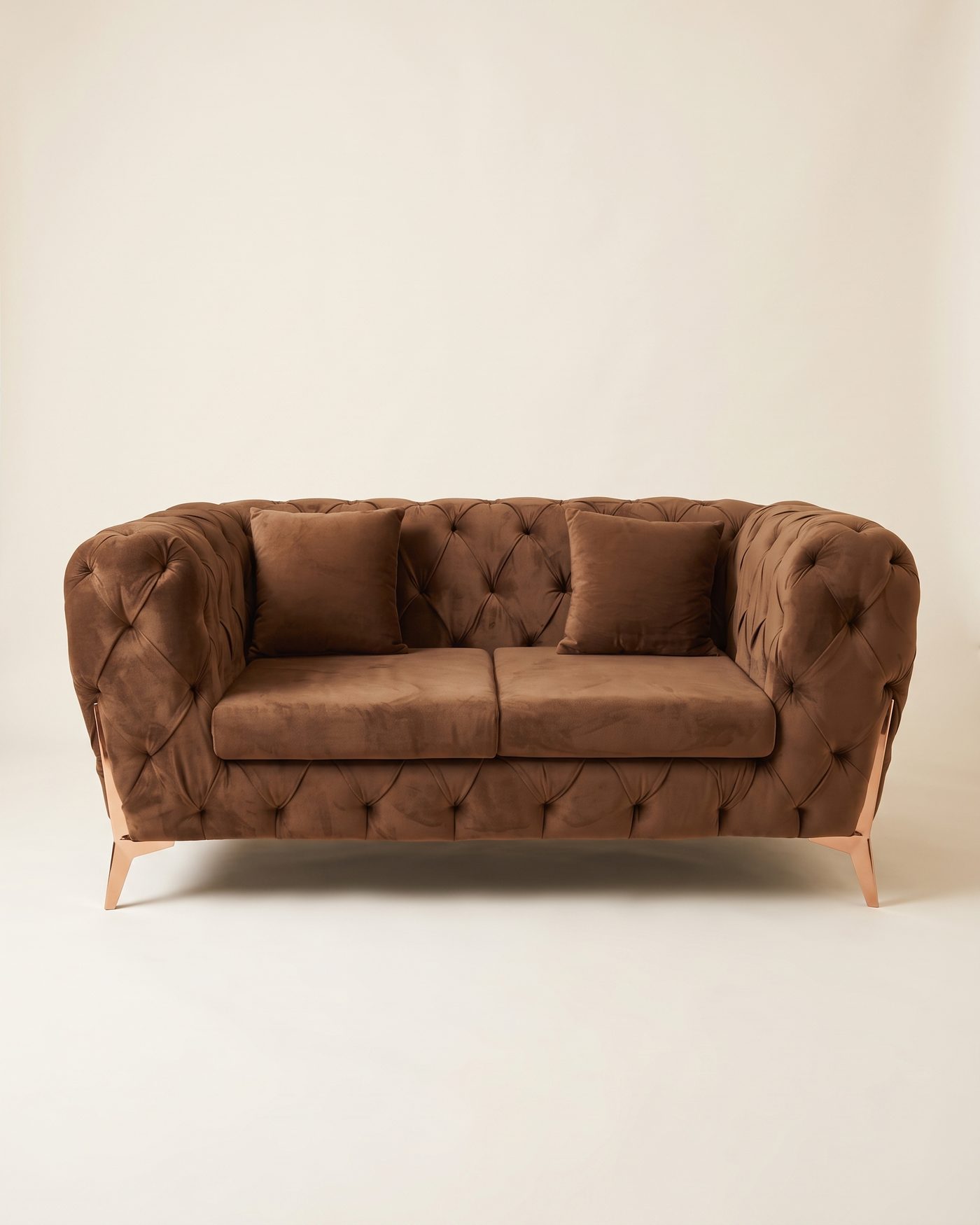 Cocoa chesterfield loveseat, studio photo