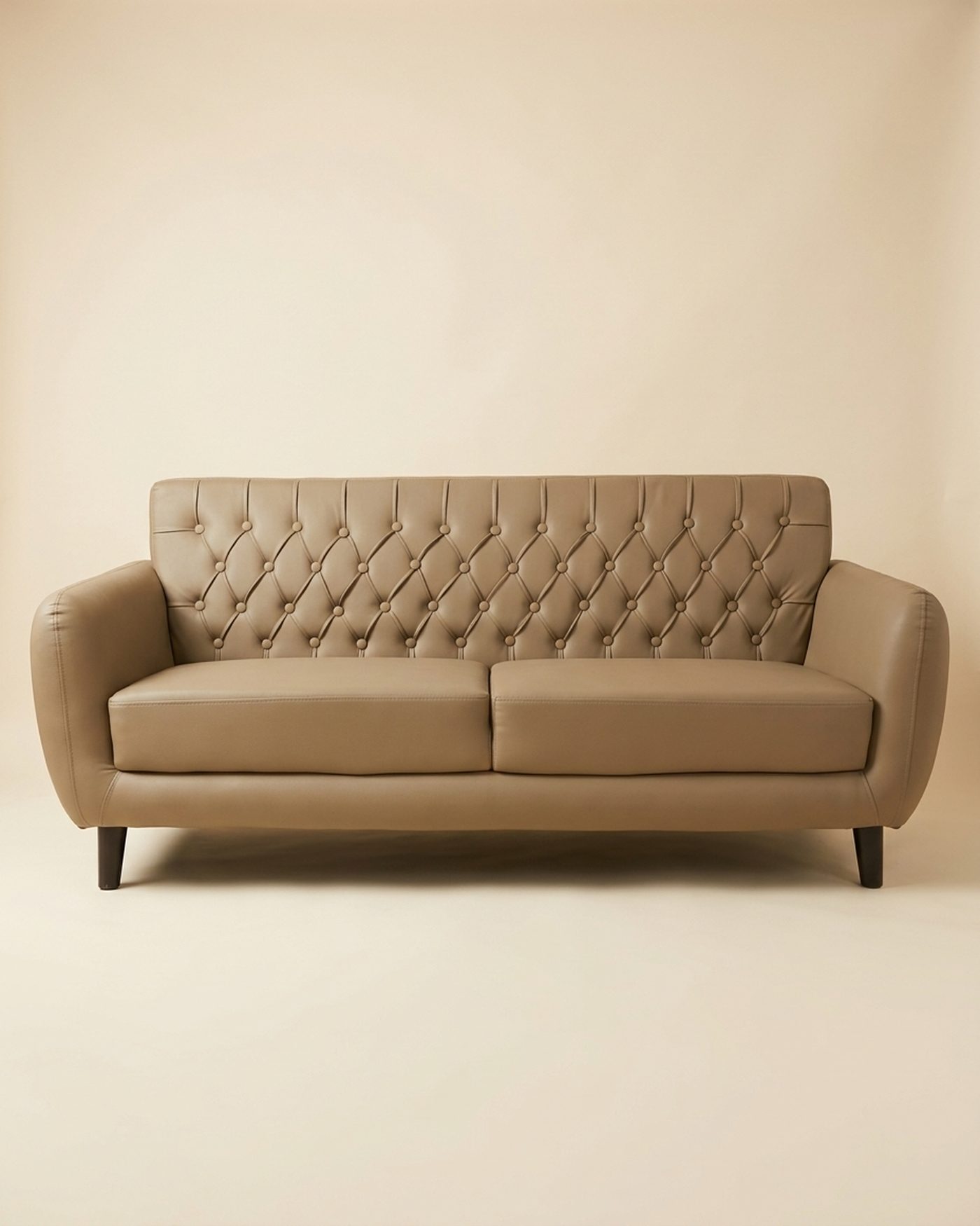 Biscotti tufted three-seater, studio photo