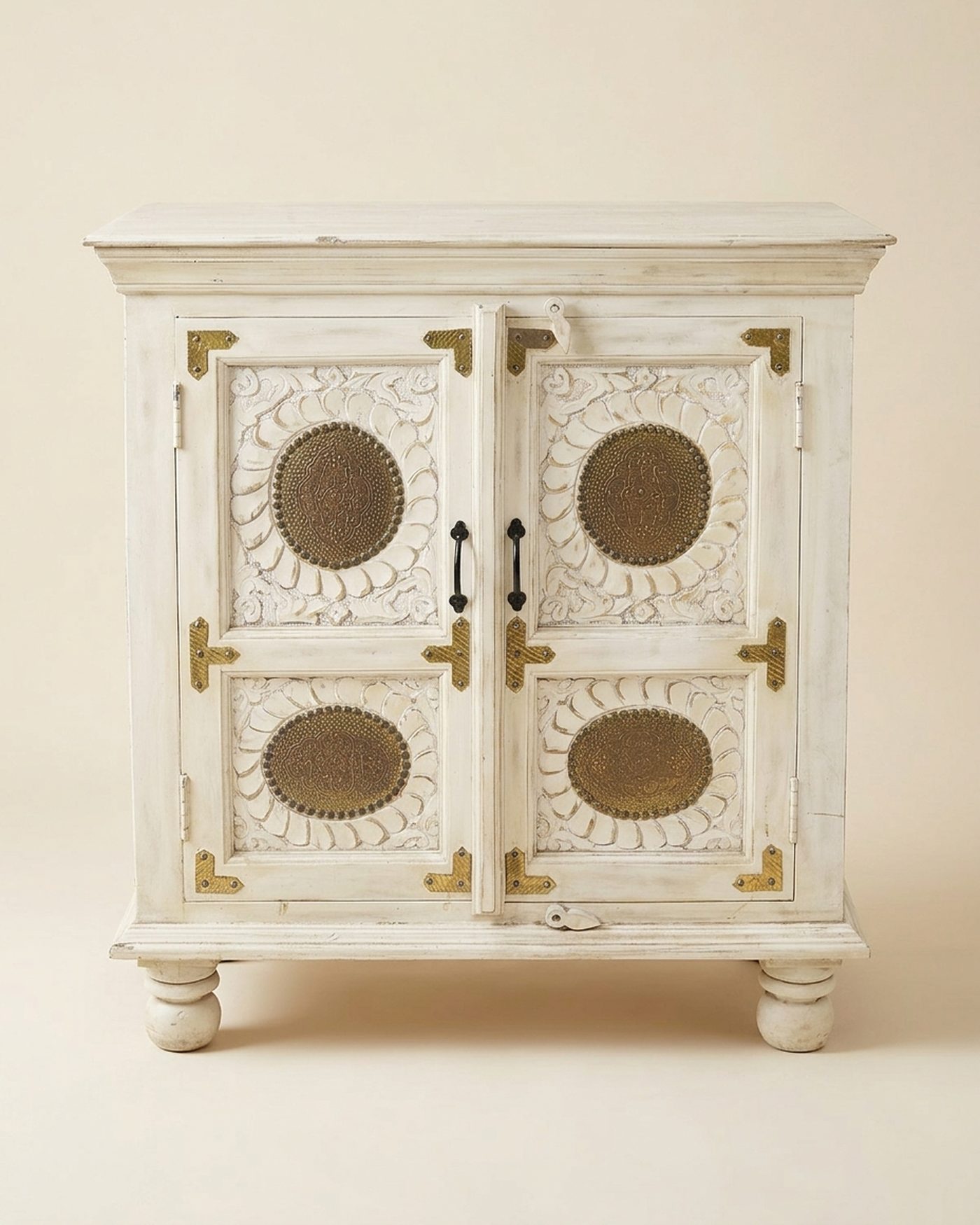 Brass Moon white cabinet with brass medallions, studio photo