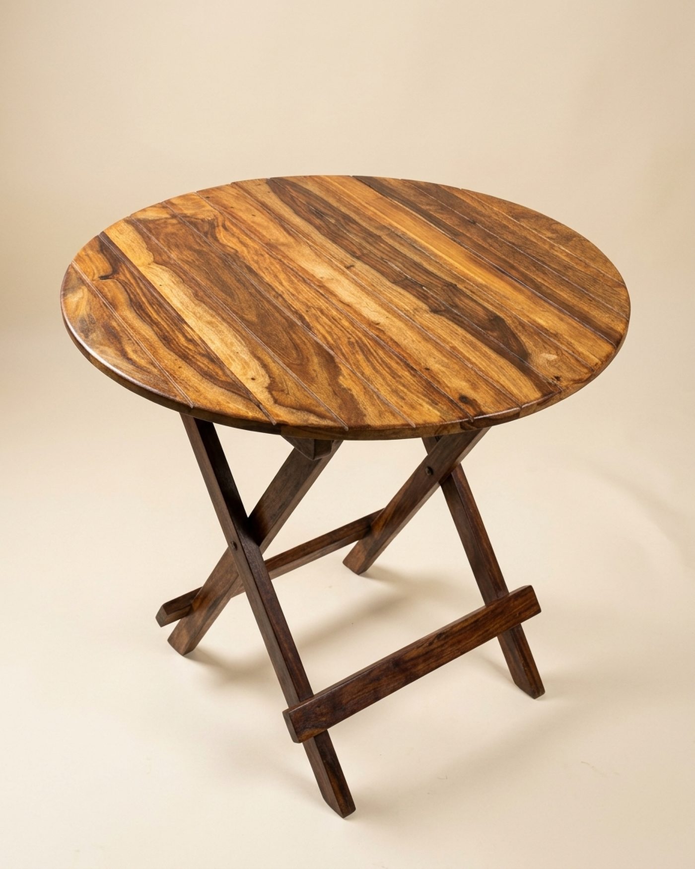 Grainy round sheesham table, studio photo
