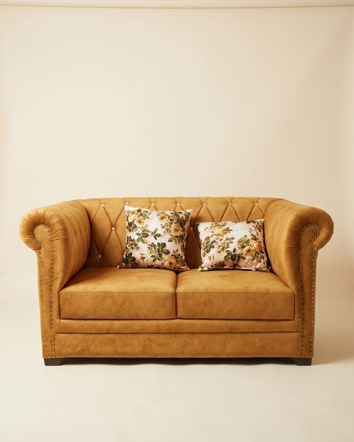 Honey chesterfield loveseat, studio photo