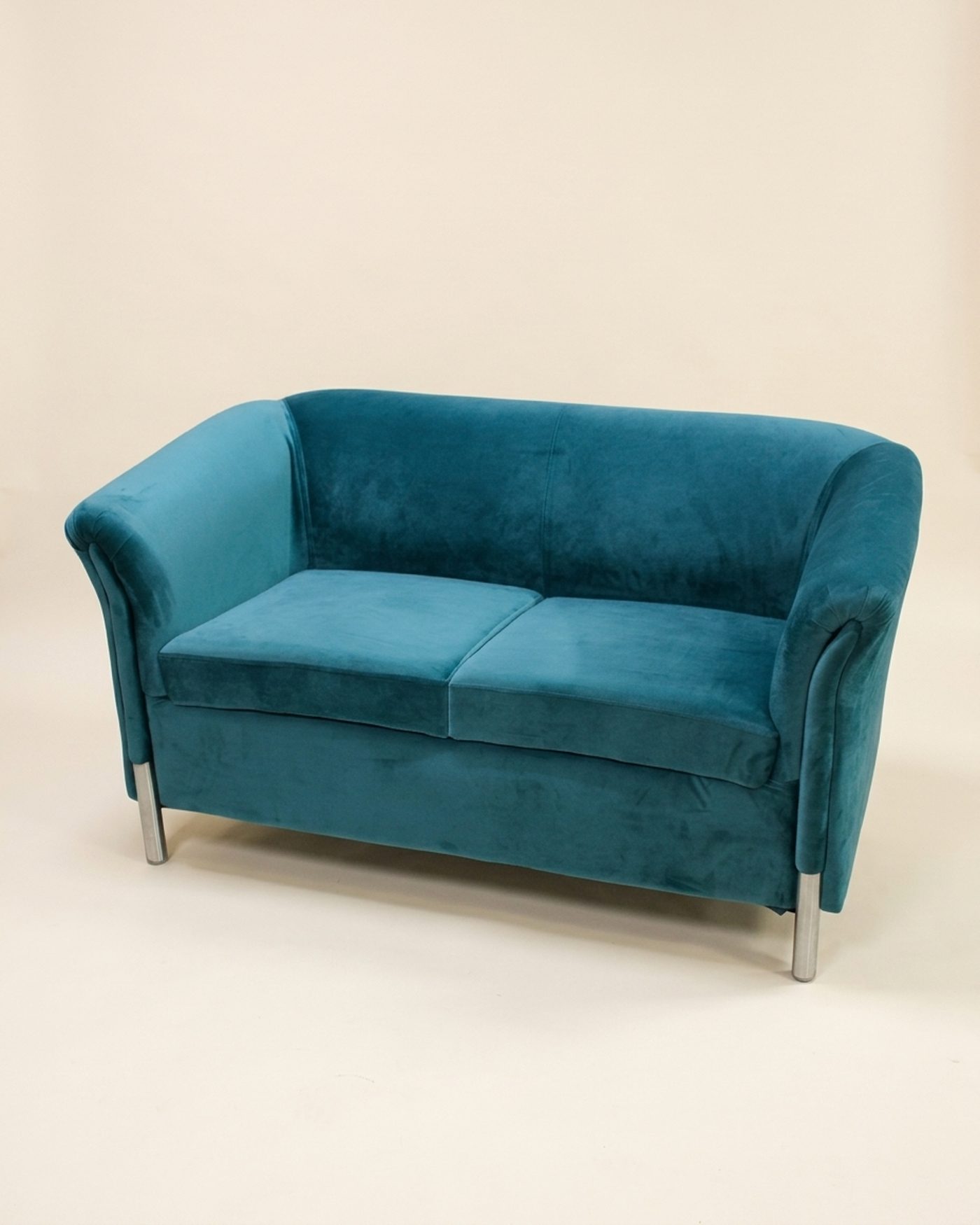 Peacock Loveseat velvet loveseat, studio photo