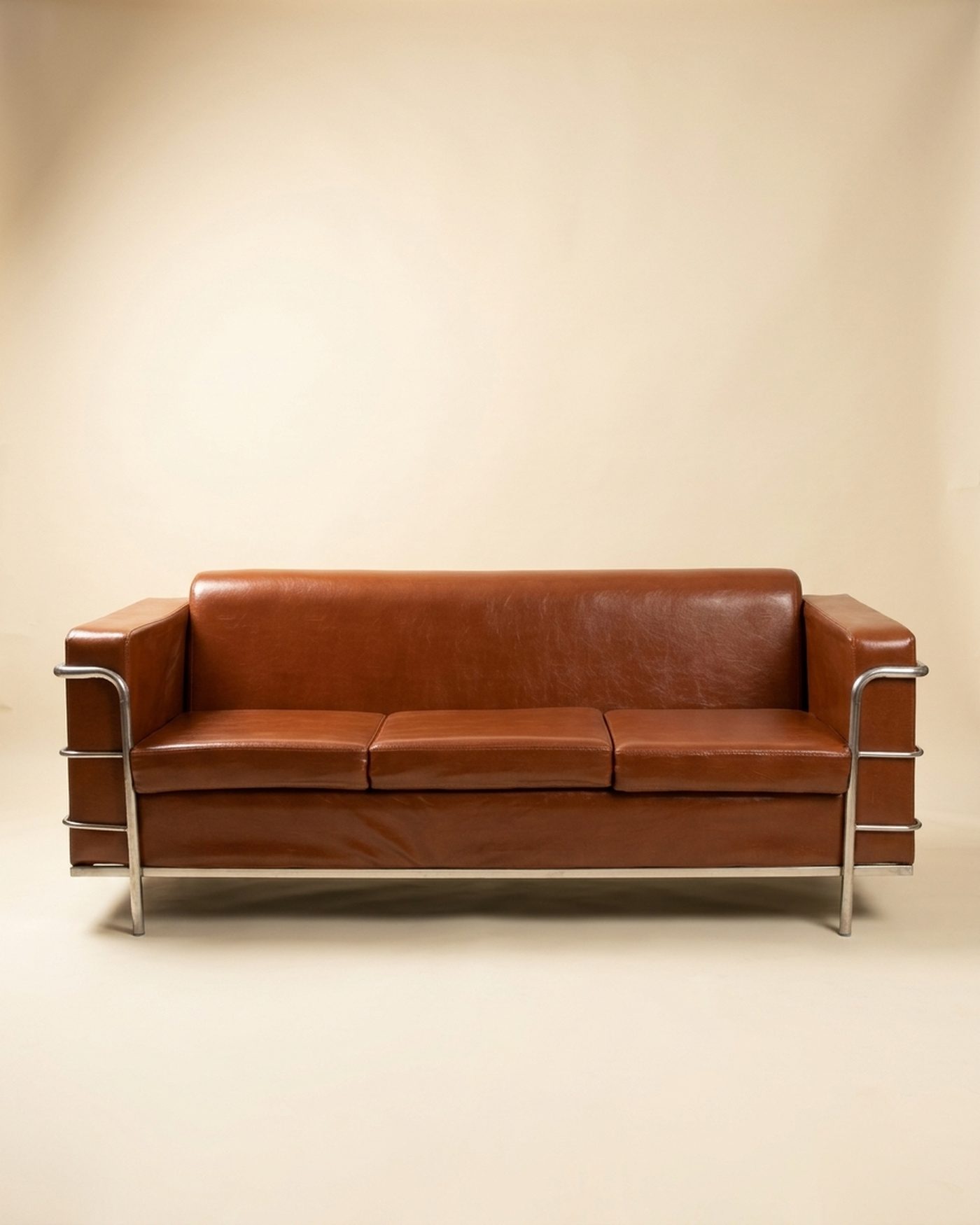 Saddle Sofa leather three-seater, studio photo