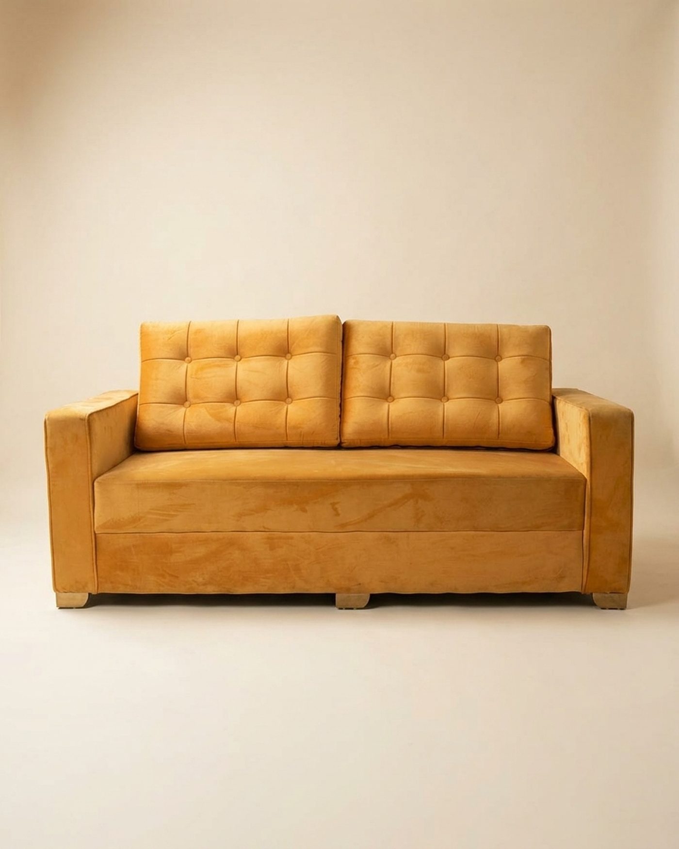 Mustard tufted sofa, studio photo