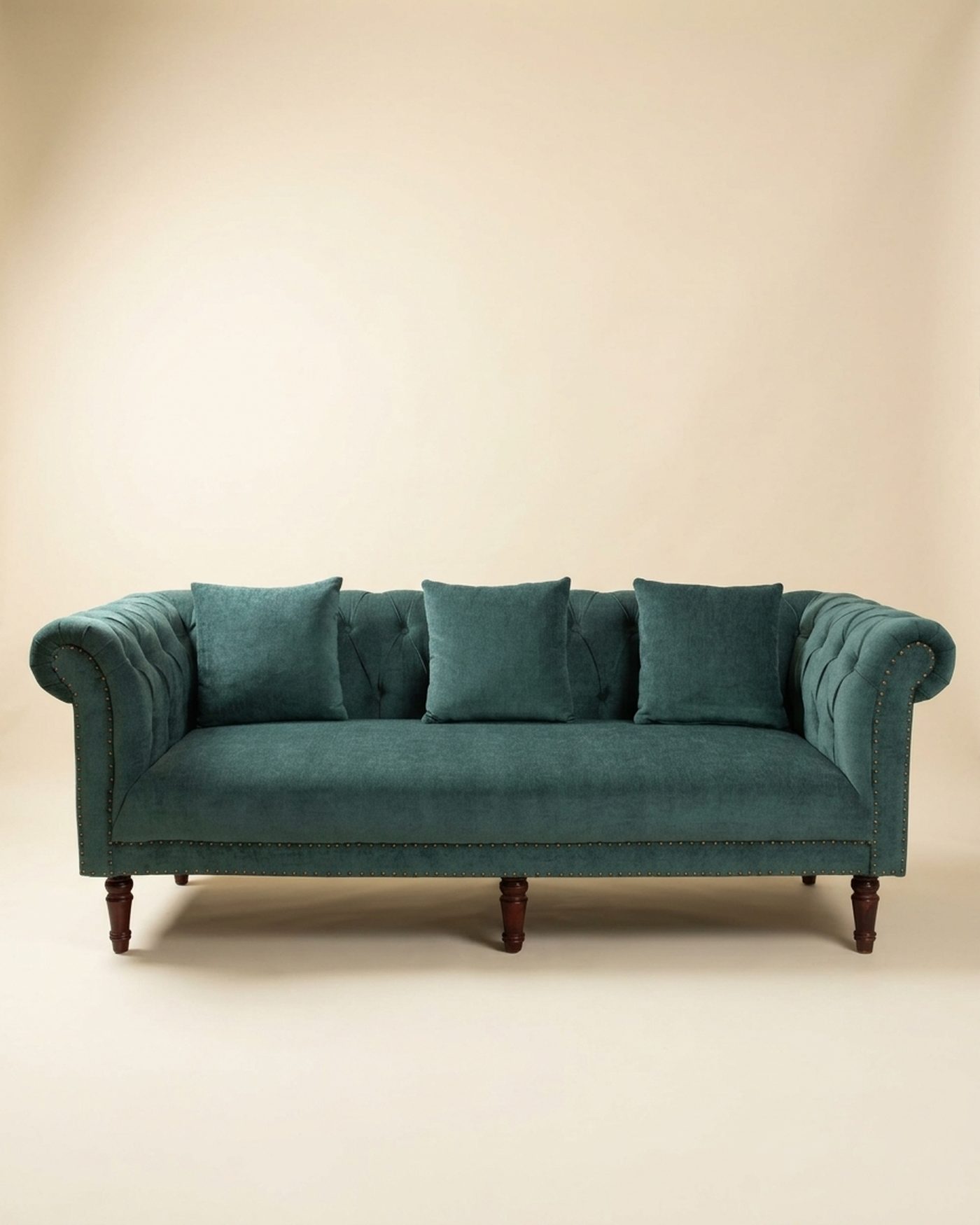 Emerald chesterfield sofa, studio photo