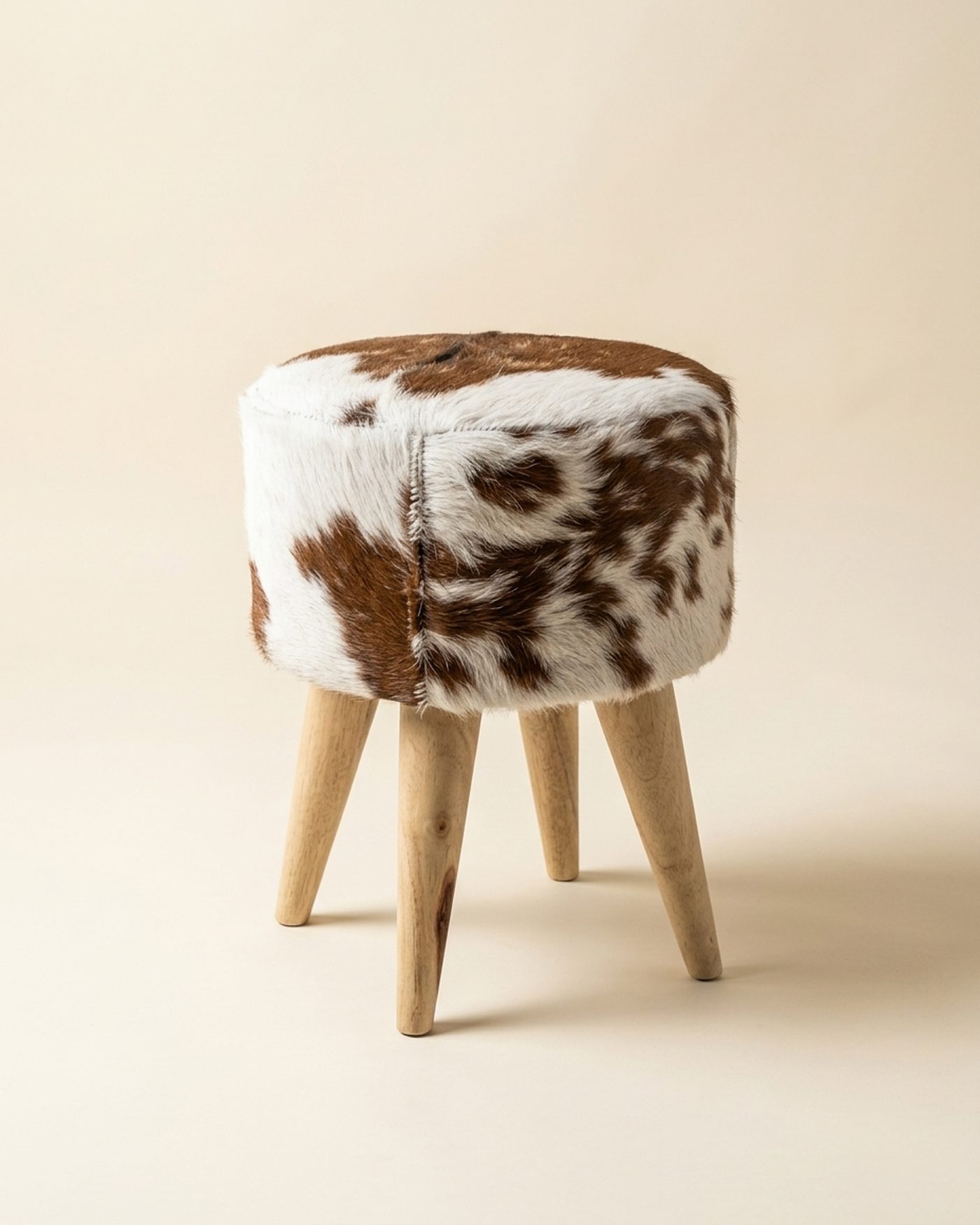 Hide cowhide stool, studio photo