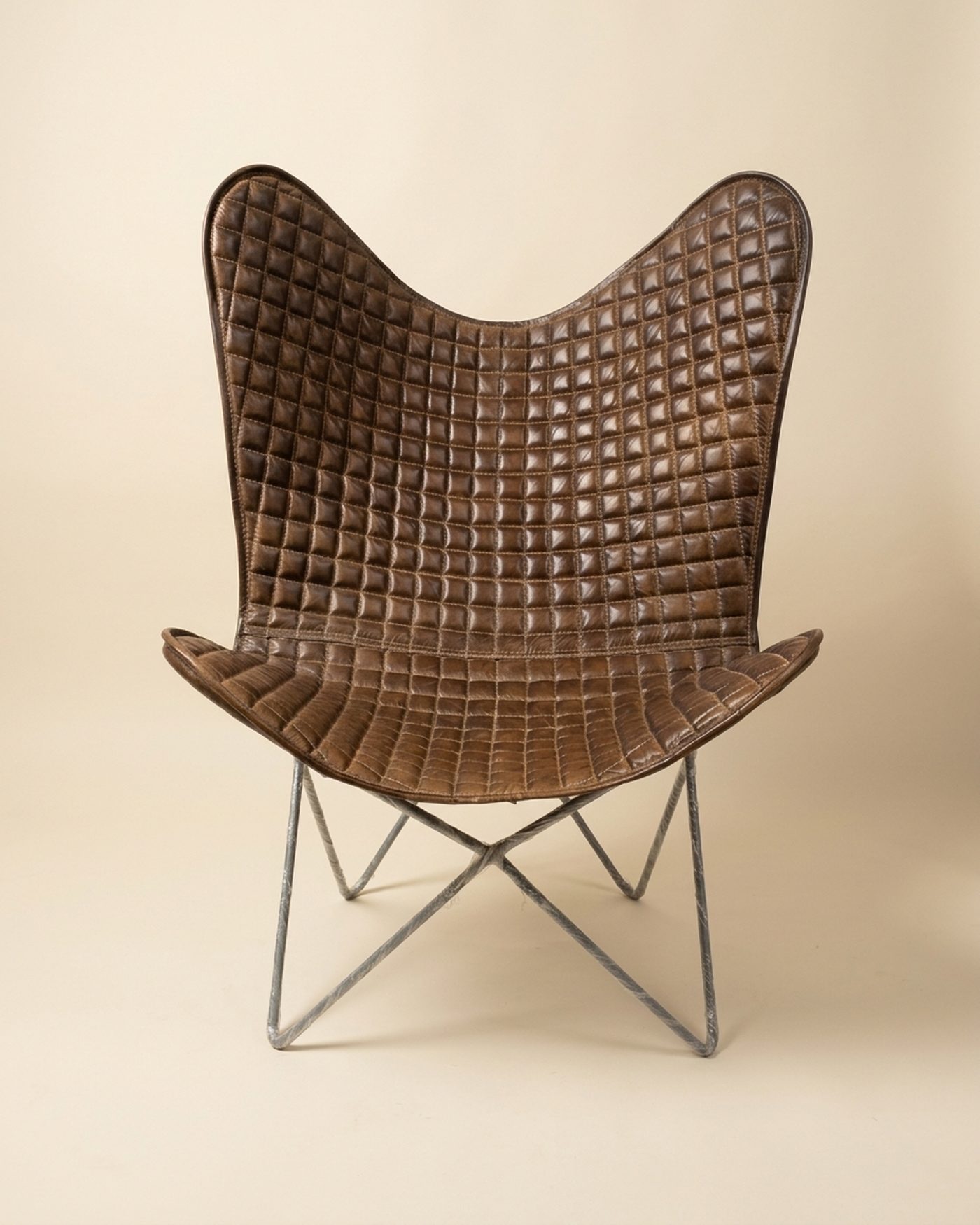 Lattice woven leather butterfly chair, studio photo