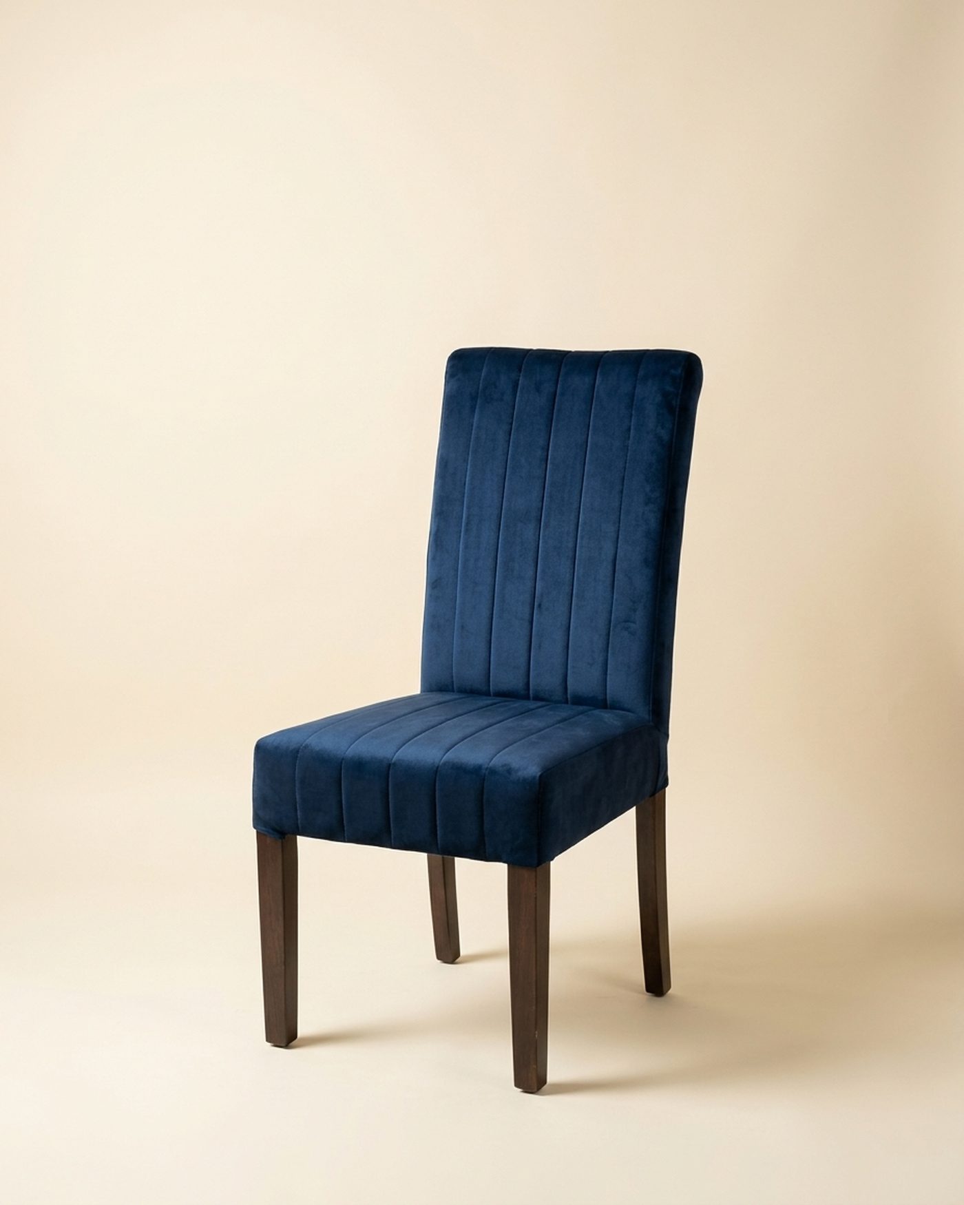 Navy velvet dining chair, studio photo