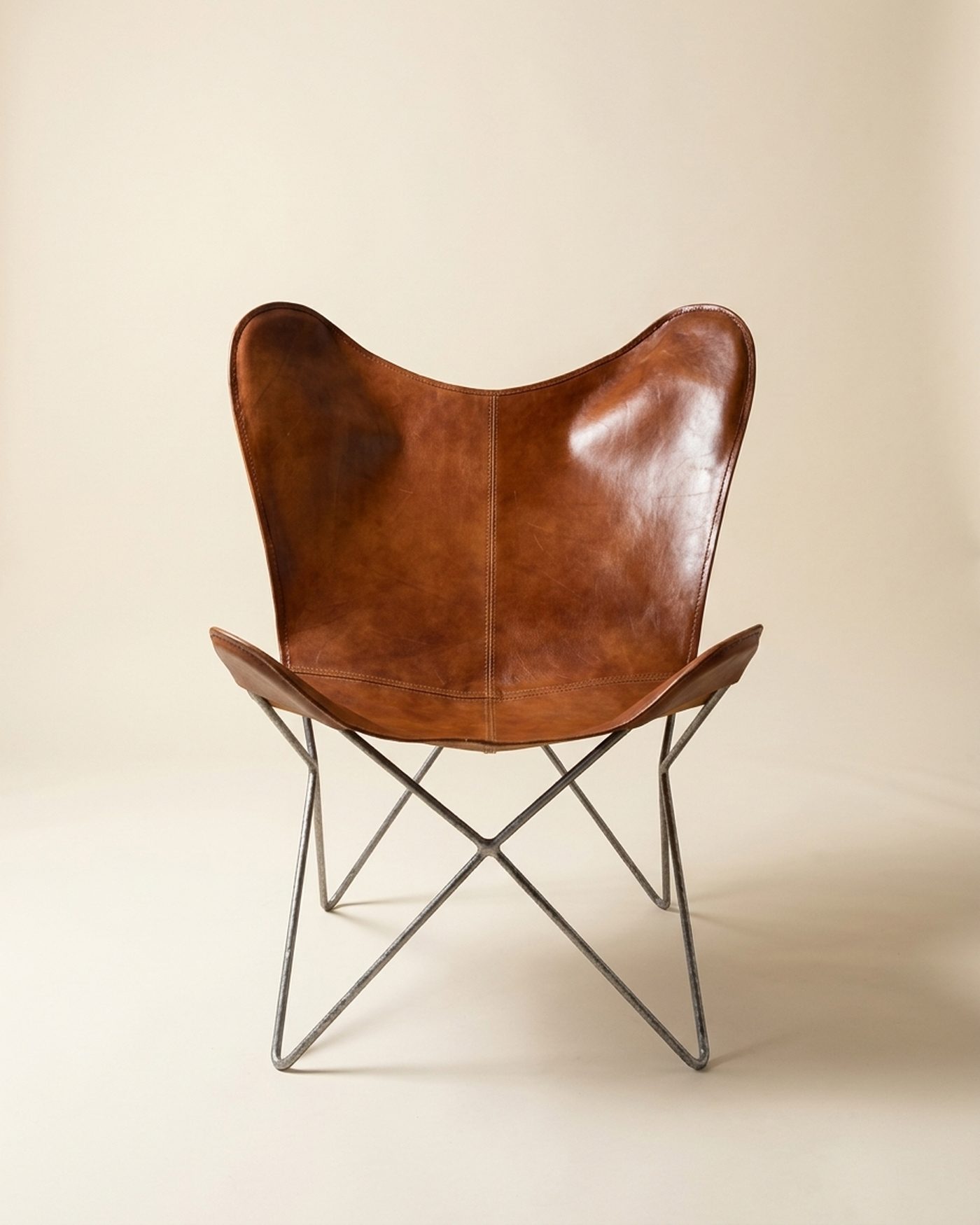 Saddle leather butterfly chair, studio photo
