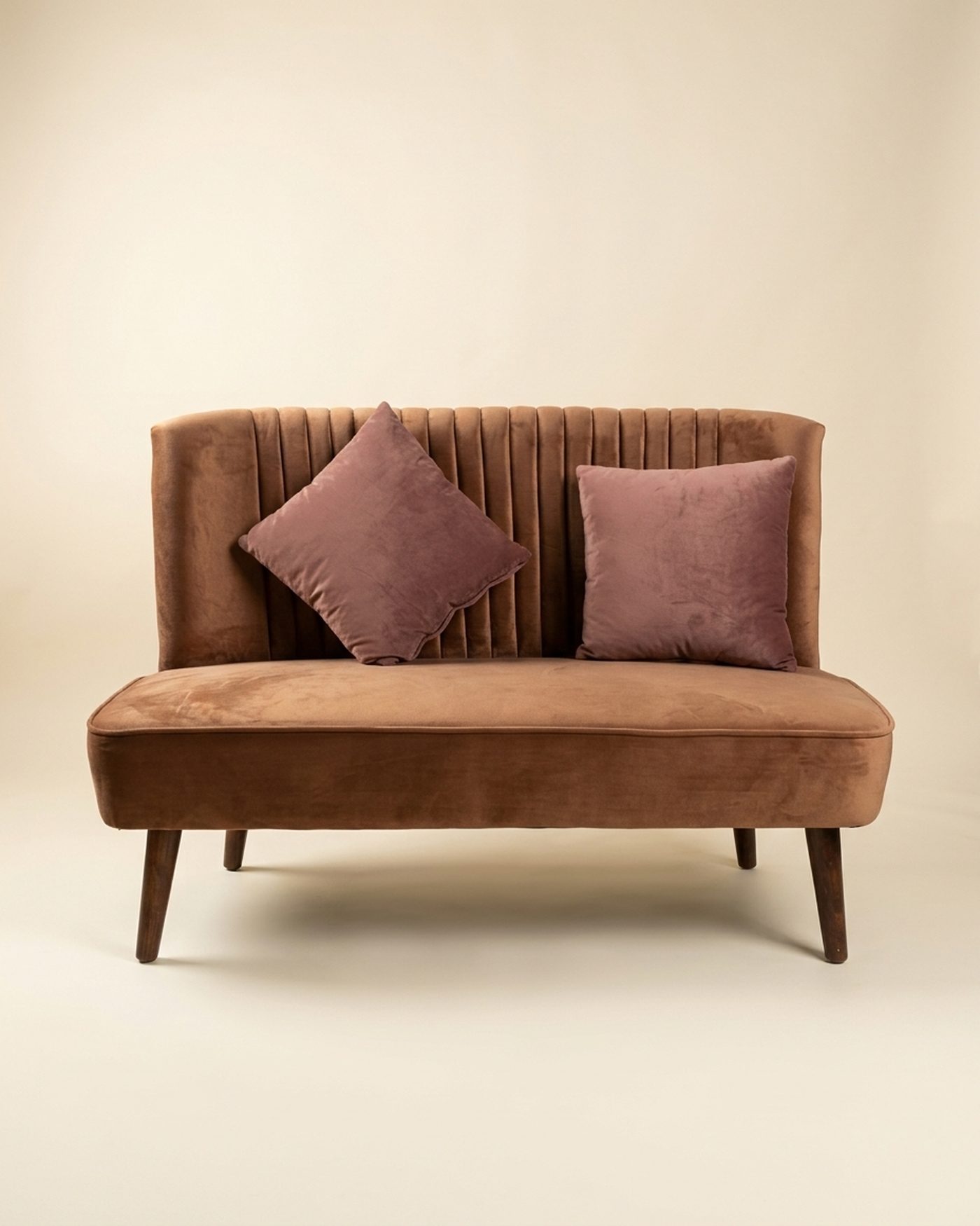 Tan loveseat, studio photo