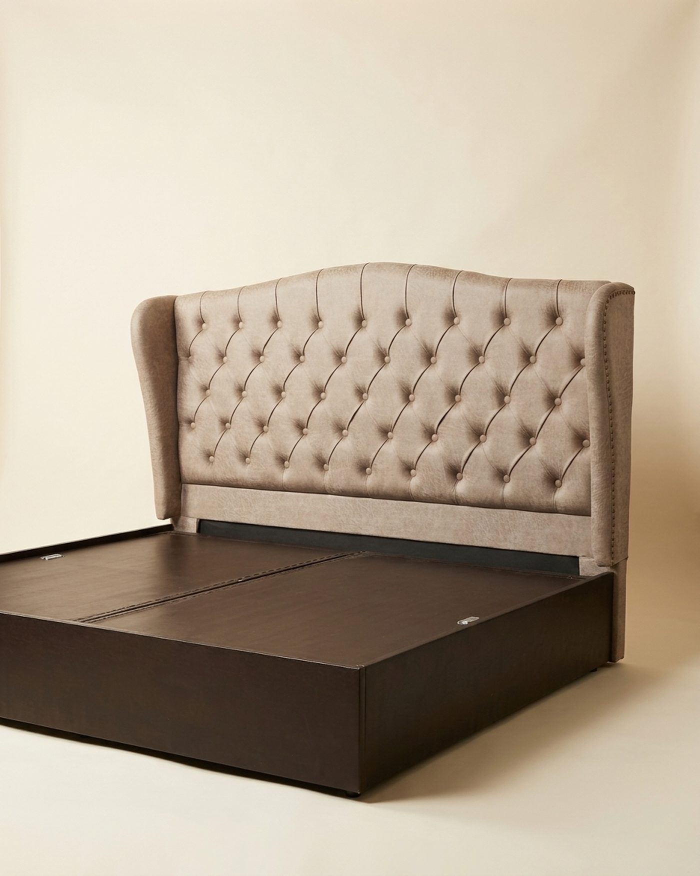 Tufted wing headboard bed, studio photo