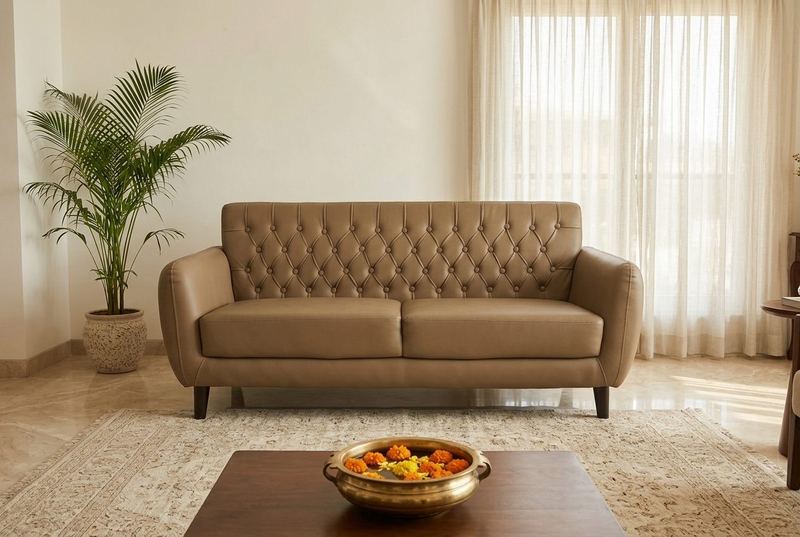 Biscotti tufted three-seater in a styled room