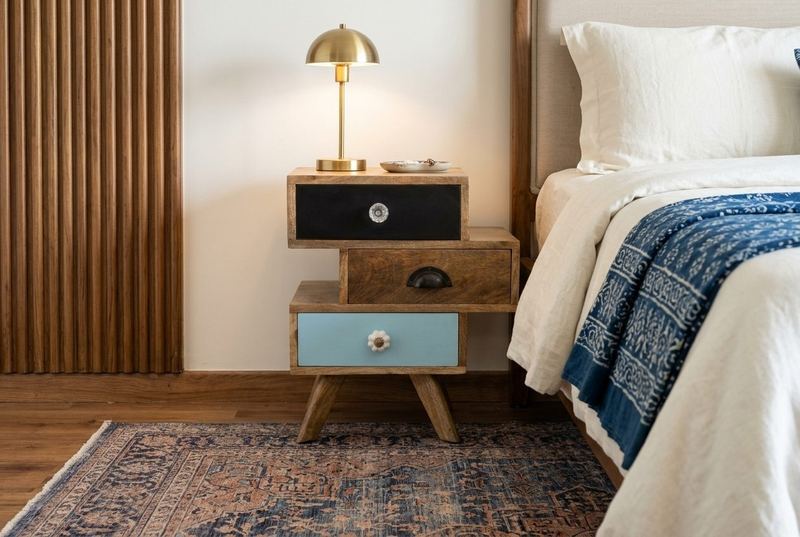 Patchwork drawer bedside table in a styled room