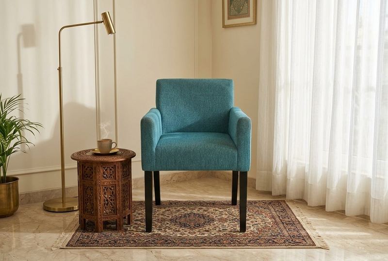 Seafoam upholstered armchair in a styled room