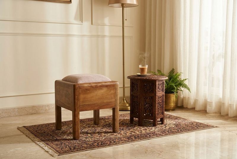 Tuffet upholstered stool in a styled room