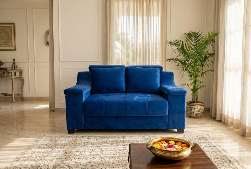 Cobalt velvet loveseat in a styled room