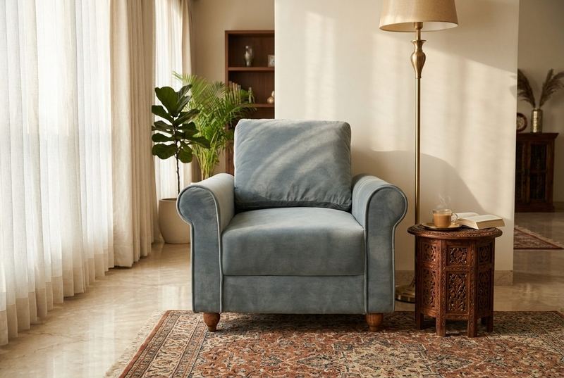 Slate Roll roll-arm armchair in a styled room