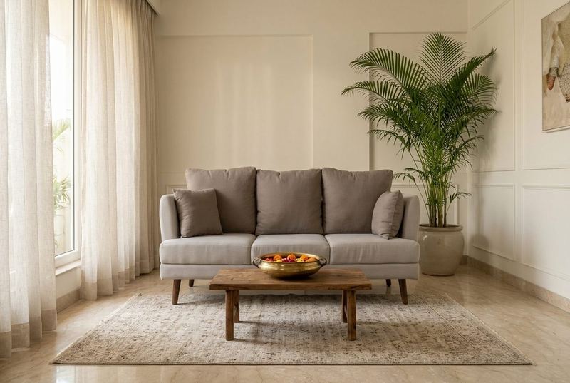Ash three-seat sofa in a styled room