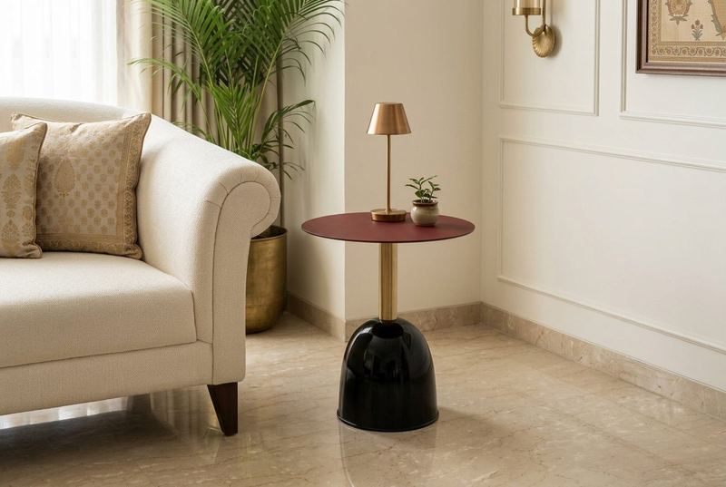 Garnet pedestal side table in a styled room