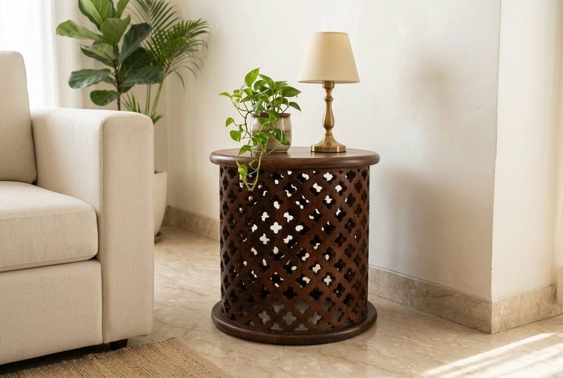 Jaali carved drum side table in a styled room